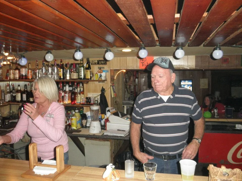 Homer and Janice Starling behind the bar at J's Landing
